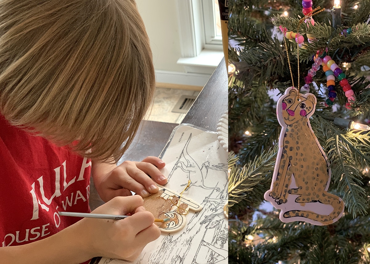 Child painting a wooden ornament as part of a DIY advent calendar craft.