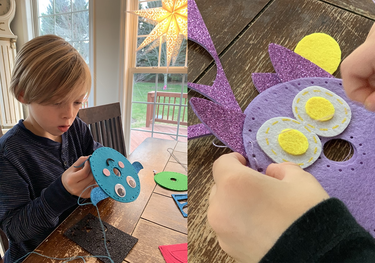 Kids sewing felt crafts as part of cozy DIY advent calendar activities.